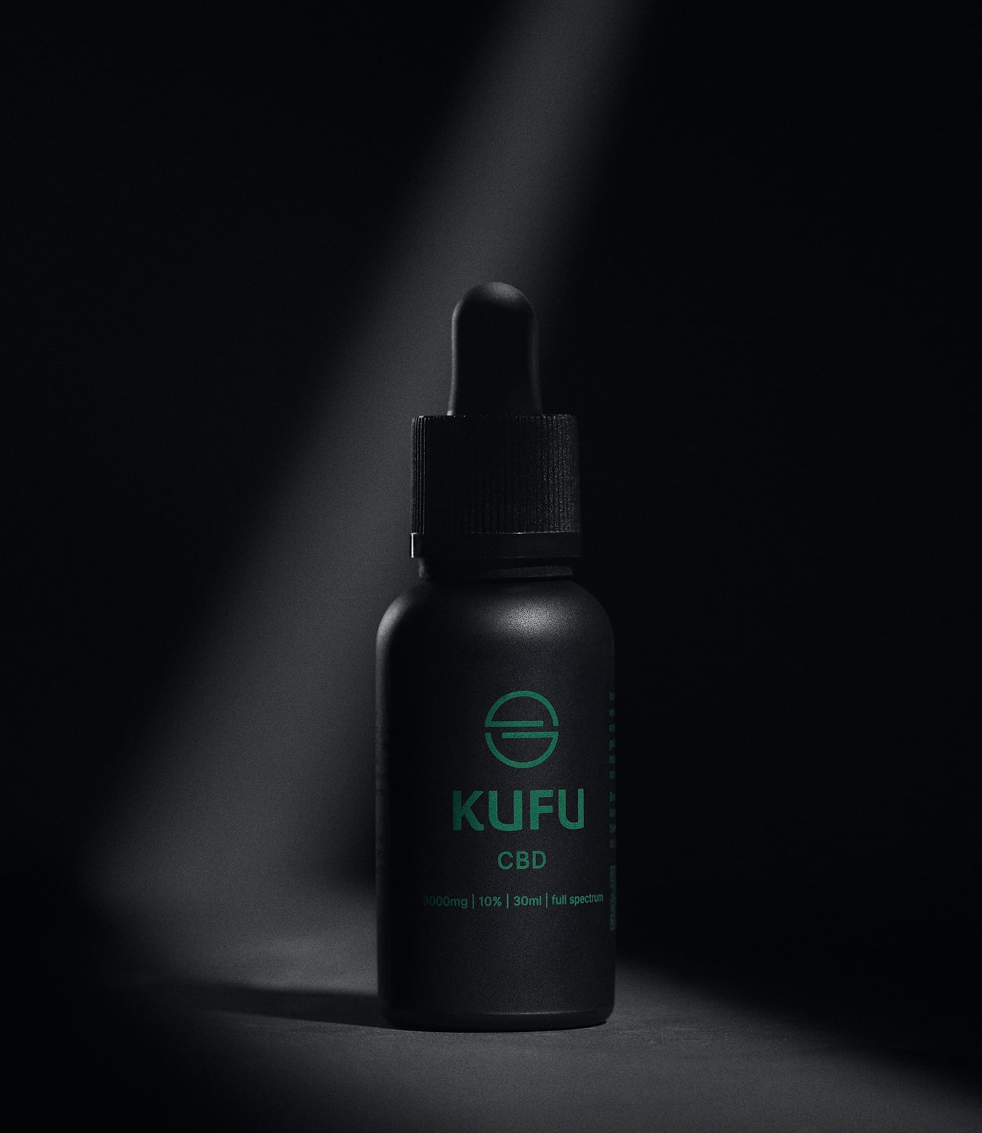 KUFU Black bottle on a black background, with a highlight over