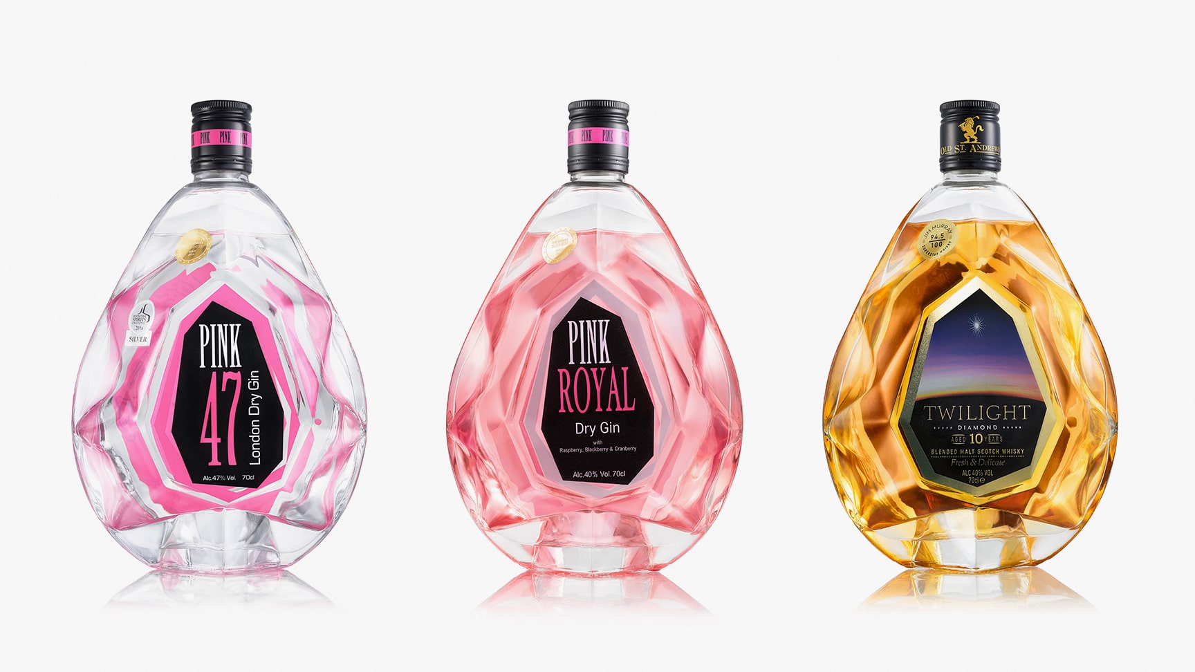 Product photography on white background, of 3 whiskey bottles: Pink 47, Pink Royal and Twilight Diamond. The whiskey bottles are well lit, have vivid colors, and clean reflections.