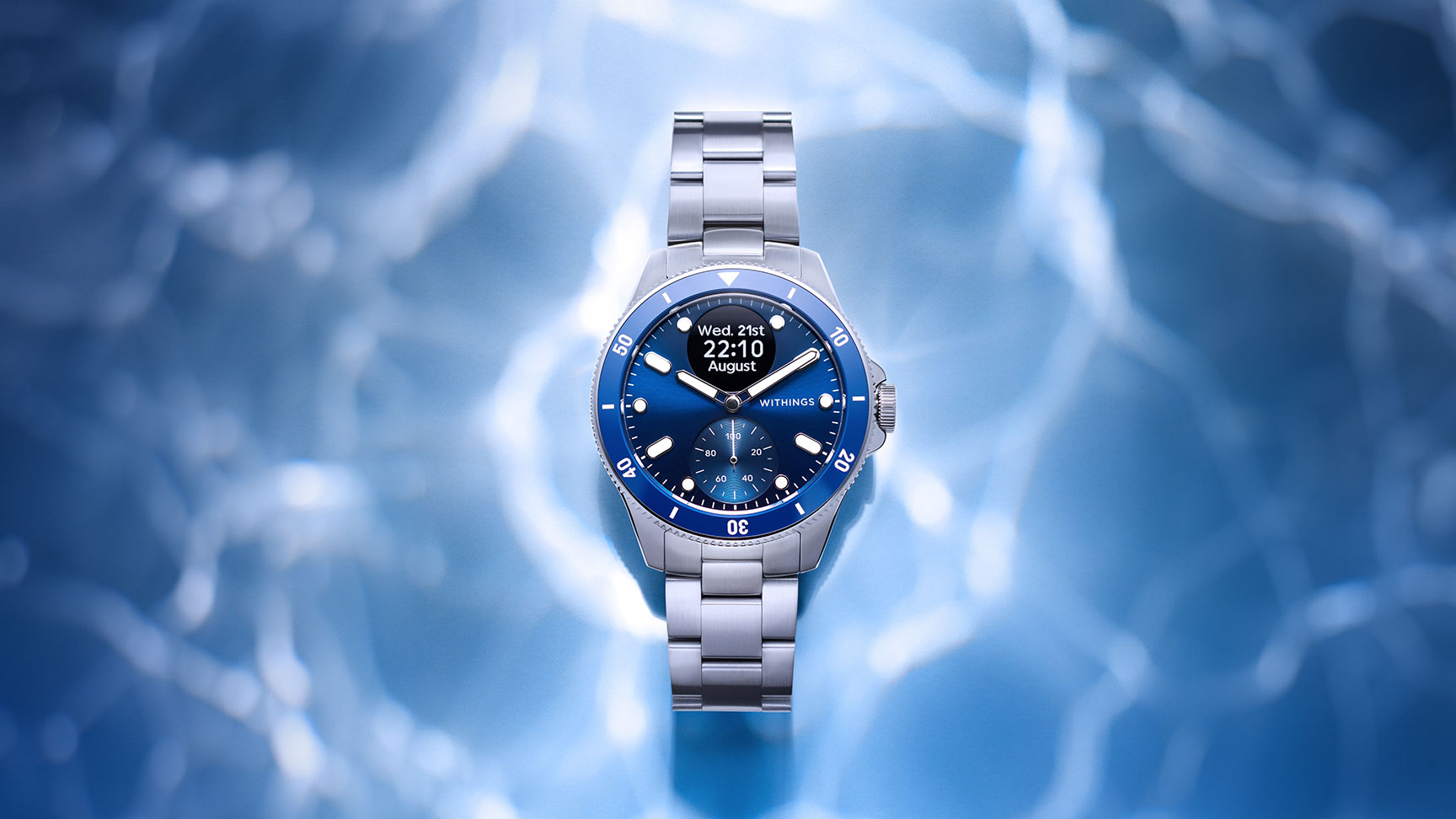 Landscape mood photo of a Withings SmartWatch Nova with an underwater effect made with lighting techniques